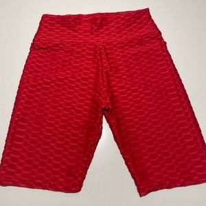 Red scrunchy “what” bike shorts